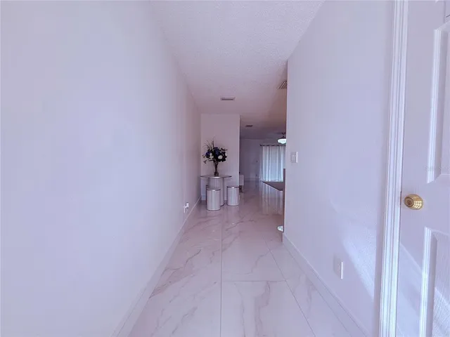 a living room with furniture and white walls