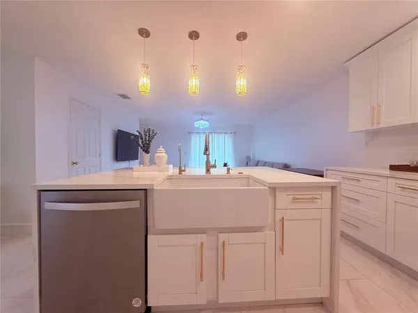 a living room with furniture and white walls
