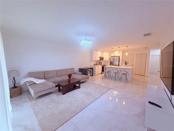 a kitchen with a table and chairs in it