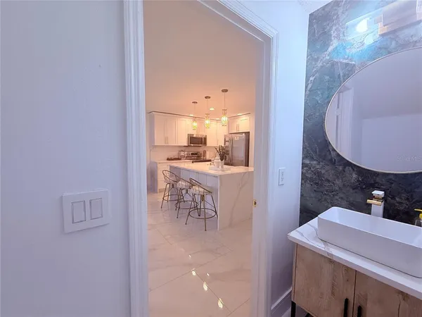 a bathroom with a toilet and a mirror