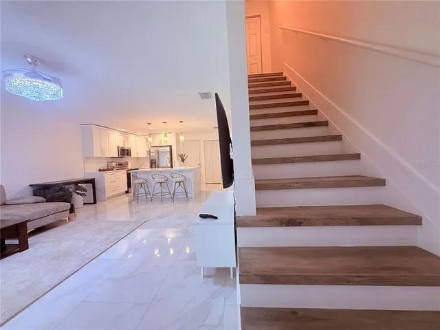 a bedroom with a bed and a view of bedroom