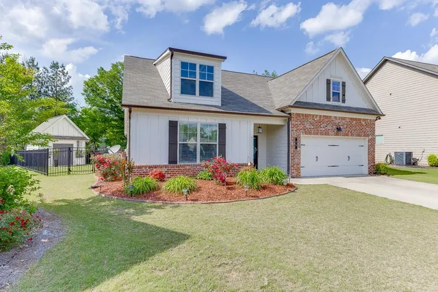 front view of a house with a yard