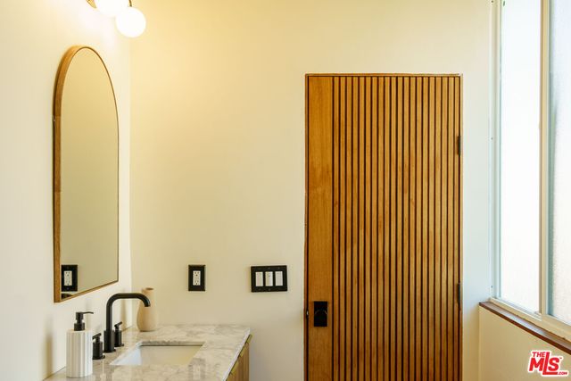 a close view of a sink and a mirror