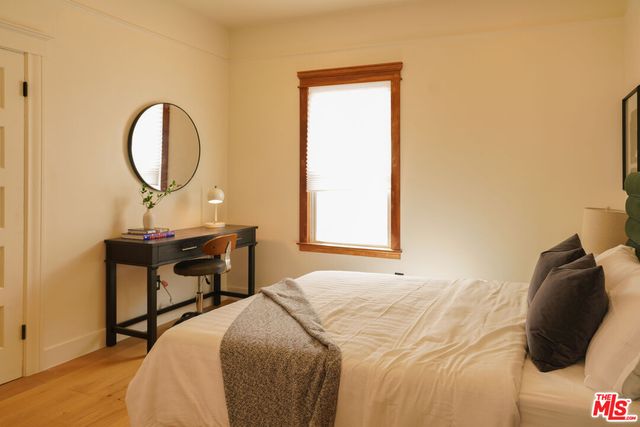 a bedroom with a bed and a table