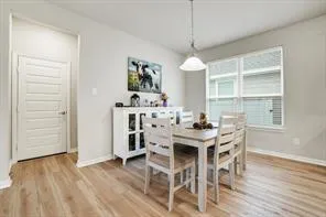 a kitchen with a sink appliances and cabinets
