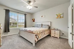 a bathroom with a glass shower door and a sink