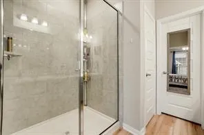 a bathroom with double vanity sinks and a mirror