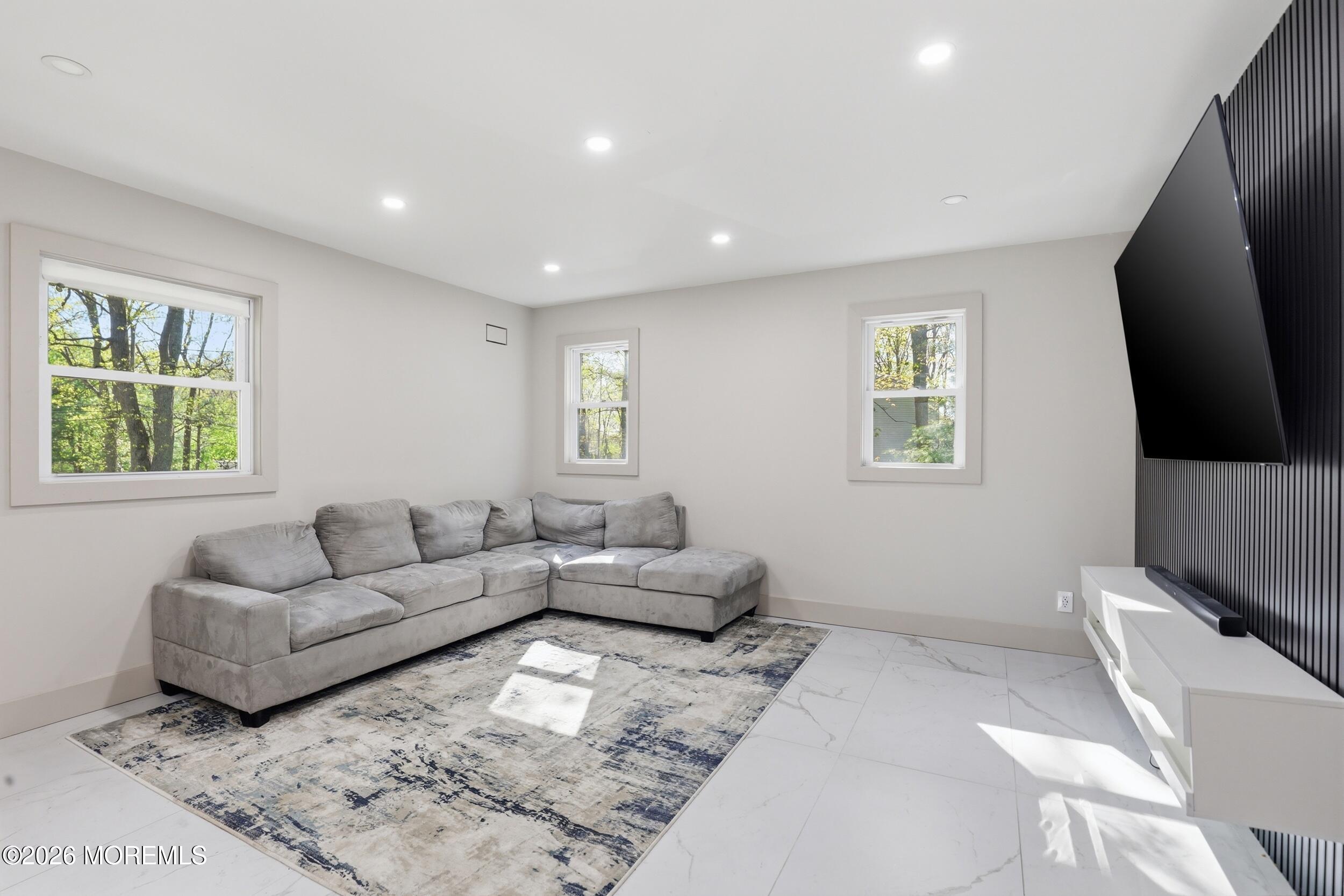 492 Cobain Road Jackson, NJ 08527 - Photo 11 of 47 a living room with furniture and a flat screen tv