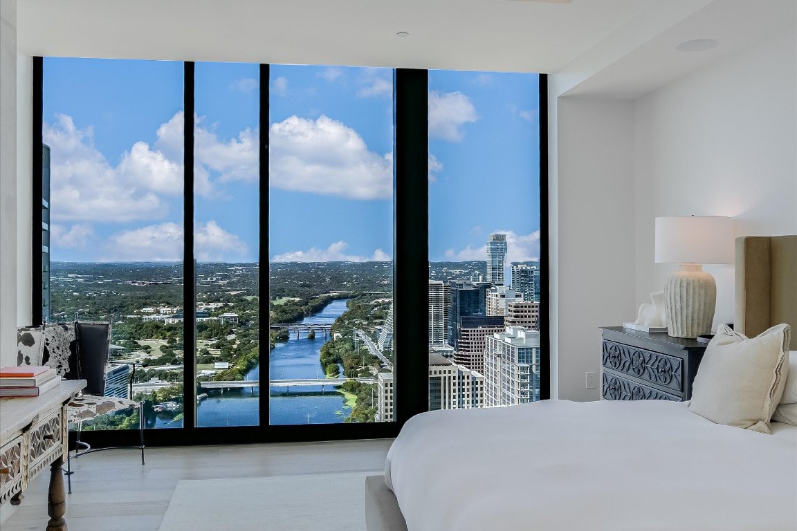 610 Davis Street, Unit 4603 Austin, TX 78701 - Photo 16 of 38 a bedroom with a large window and a bed