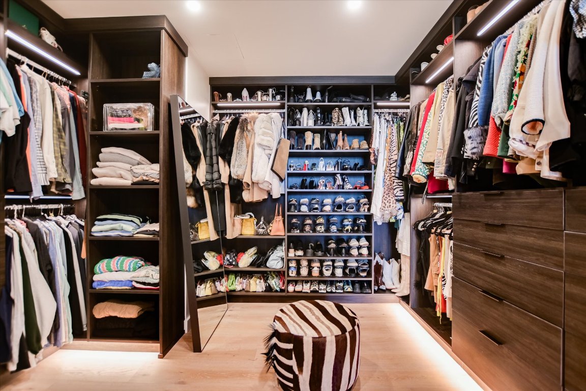 610 Davis Street, Unit 4603 Austin, TX 78701 - Photo 21 of 38 a view of walk in closet with clothes and shoes