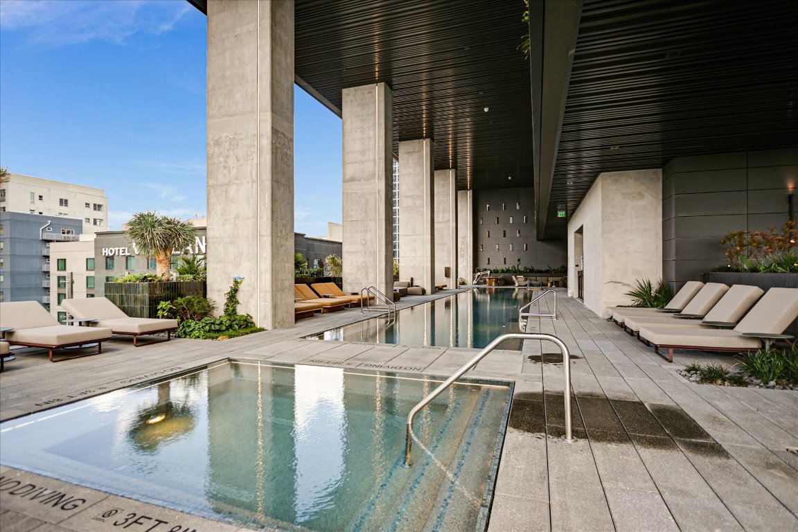 610 Davis Street, Unit 4603 Austin, TX 78701 - Photo 35 of 38 a view of a swimming pool with outdoor seating