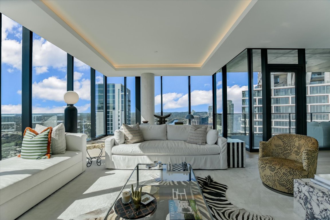 610 Davis Street, Unit 4603 Austin, TX 78701 - Photo 4 of 38 a living room with furniture and a large window