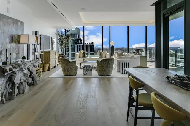 a view of a dining room with furniture window and wooden floor