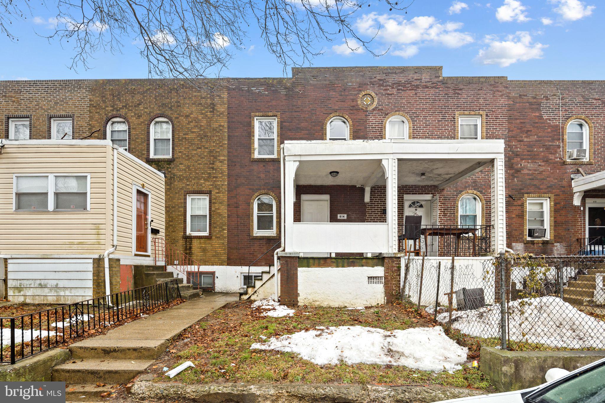 614 Littlecroft Road Upper Darby, PA 19082 - Photo 1 of 13 a front view of a house with a yard outdoor seating and garage