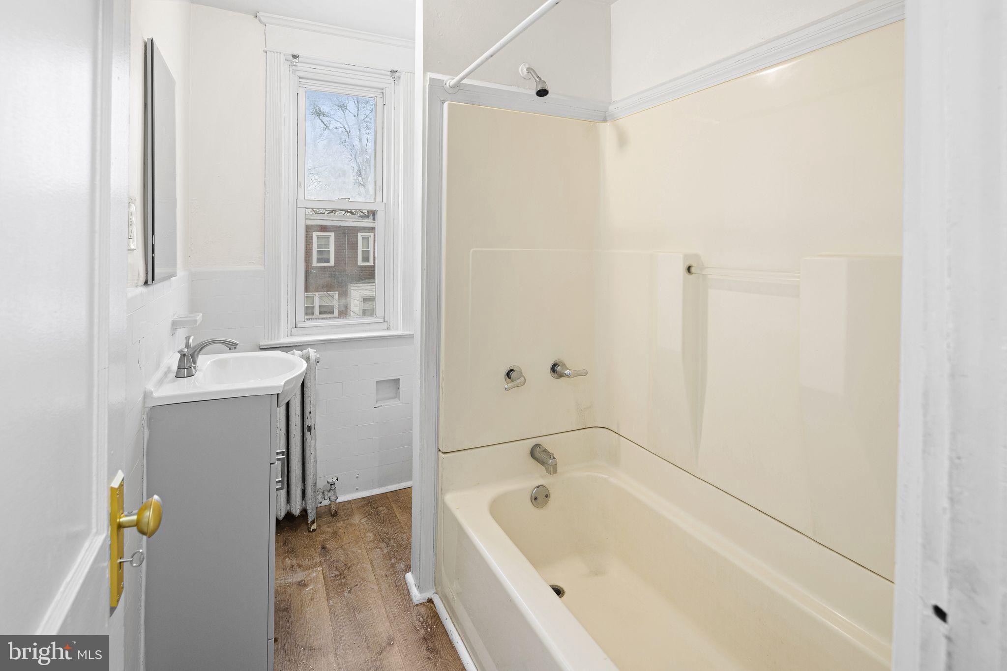 614 Littlecroft Road Upper Darby, PA 19082 - Photo 11 of 13 a bathroom with a tub a sink and a shower