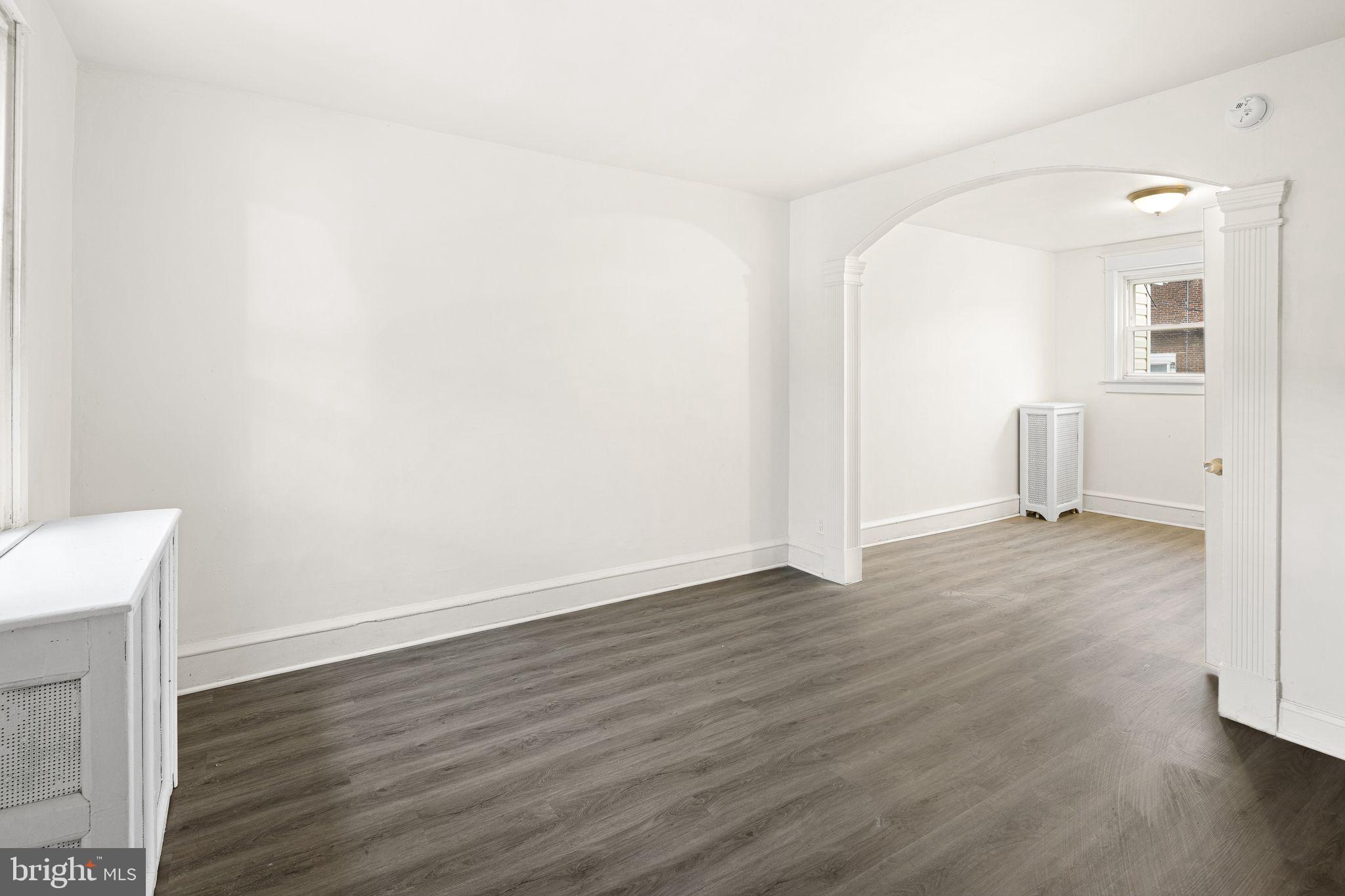 614 Littlecroft Road Upper Darby, PA 19082 - Photo 3 of 13 a view of a room with wooden floor and white walls