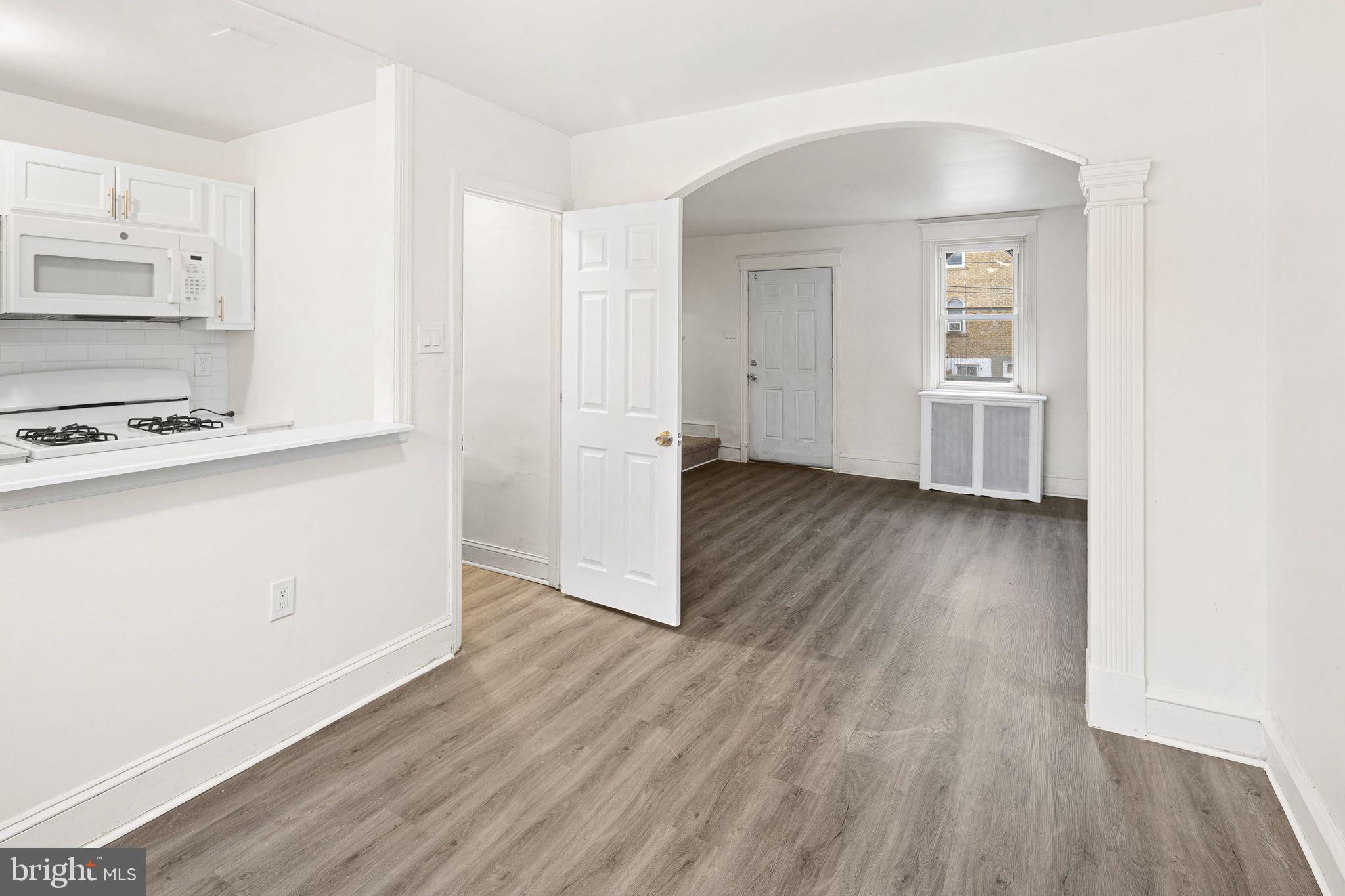 614 Littlecroft Road Upper Darby, PA 19082 - Photo 6 of 13 a view of a kitchen with wooden floor and a sink