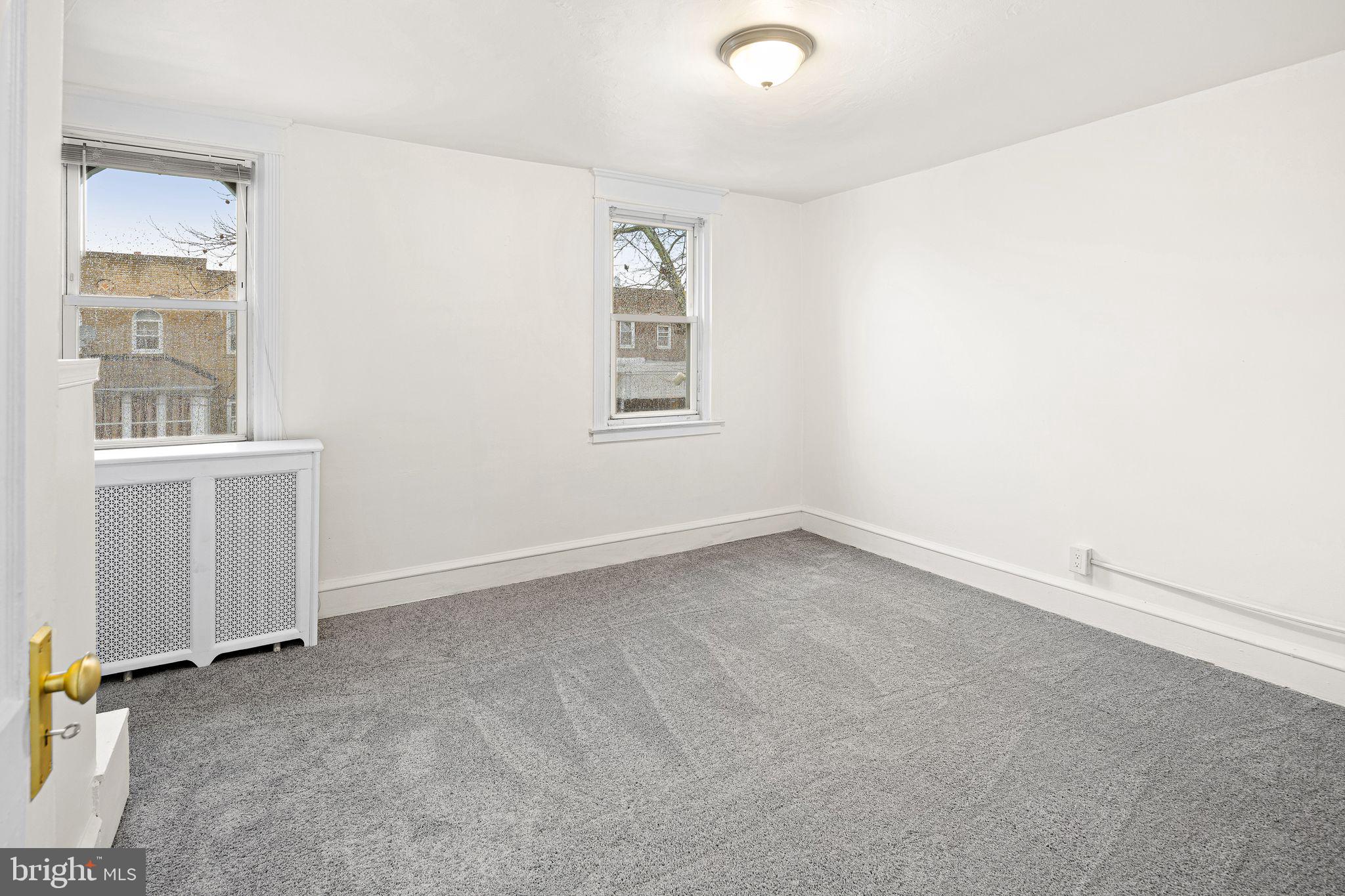 614 Littlecroft Road Upper Darby, PA 19082 - Photo 9 of 13 an empty room with a window