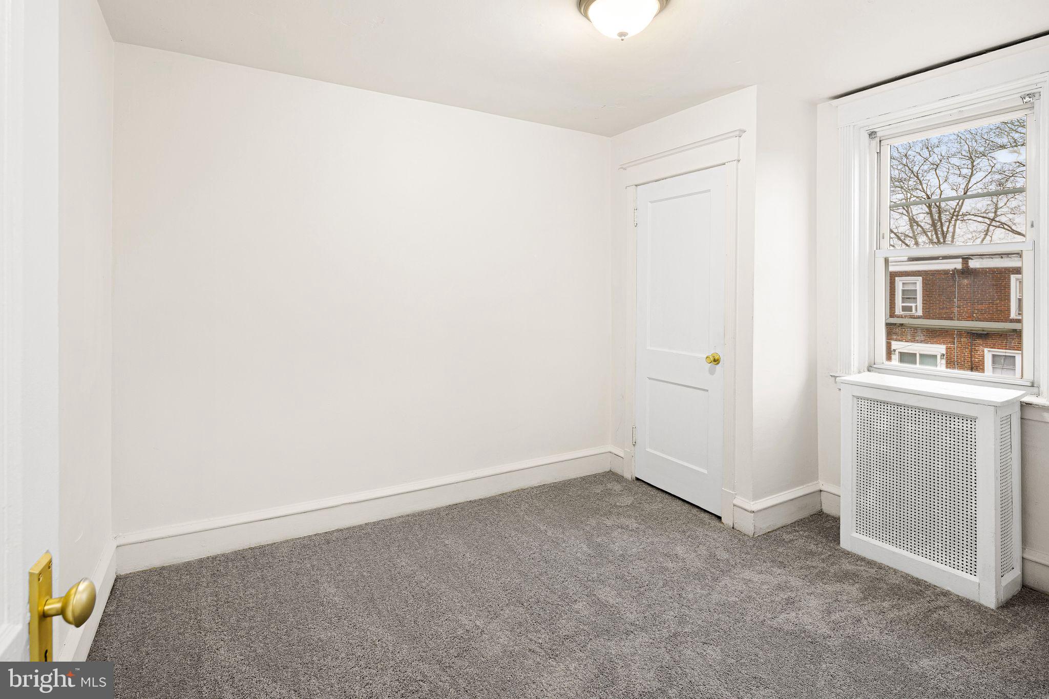 614 Littlecroft Road Upper Darby, PA 19082 - Photo 10 of 13 a view of an empty room with a window