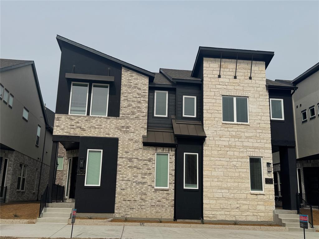 a front view of a house with stairs