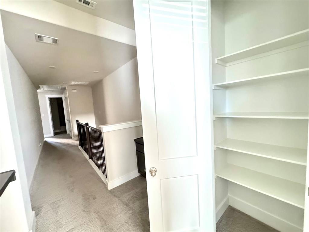 809 Meadowcrest Drive Plano, TX 75075 - Photo 14 of 30 a view of a hallway with furniture