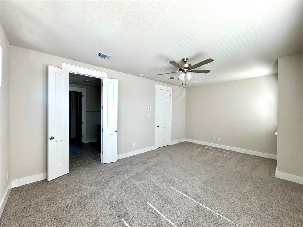 809 Meadowcrest Drive Plano, TX 75075 - Photo 17 of 30 an empty room with a ceiling fan and a window