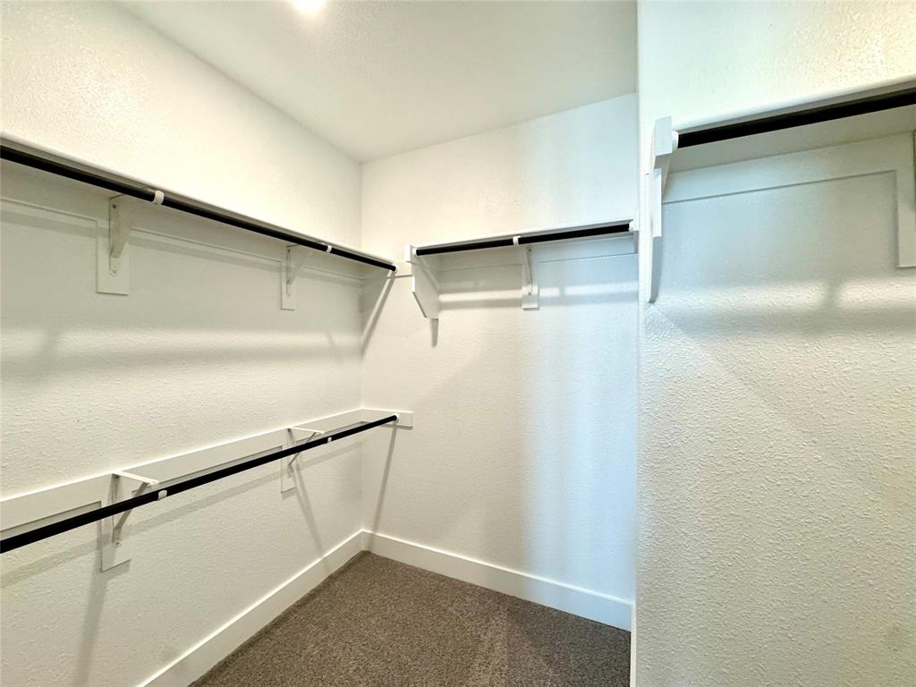 809 Meadowcrest Drive Plano, TX 75075 - Photo 23 of 30 a view of walk in closet