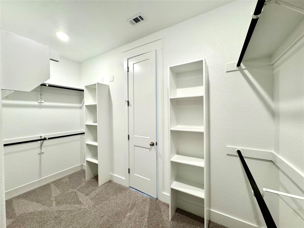 809 Meadowcrest Drive Plano, TX 75075 - Photo 24 of 30 a view of an empty walk in closet