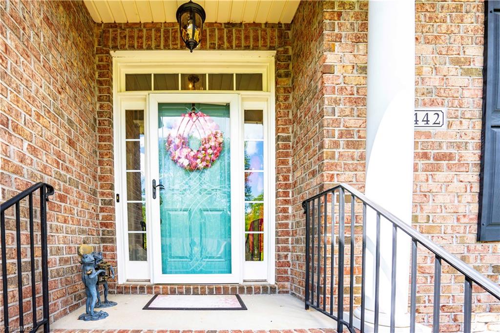 8442 Alice Player Drive Oak Ridge, NC 27310 - Photo 2 of 30 Welcoming front porch