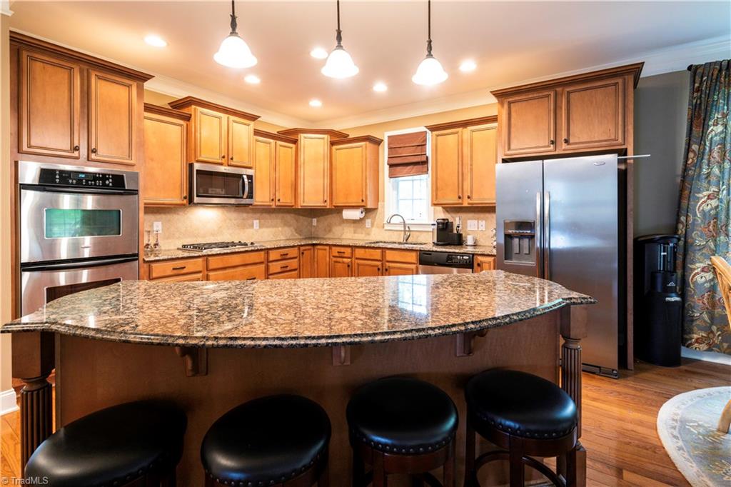 8442 Alice Player Drive Oak Ridge, NC 27310 - Photo 4 of 30 Gourmet kitchen with seating