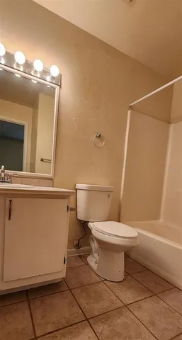 a bathroom with a toilet a sink and shower