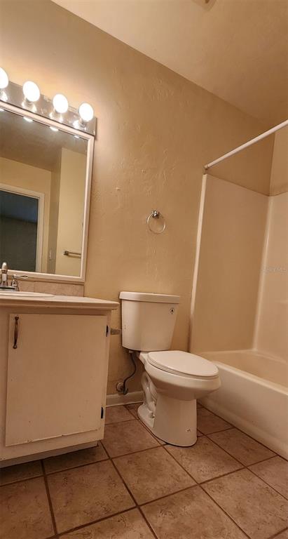 85 Southeast 16th Avenue, Unit F301 Gainesville, FL 32601 - Photo 11 of 15 a bathroom with a toilet a sink and shower