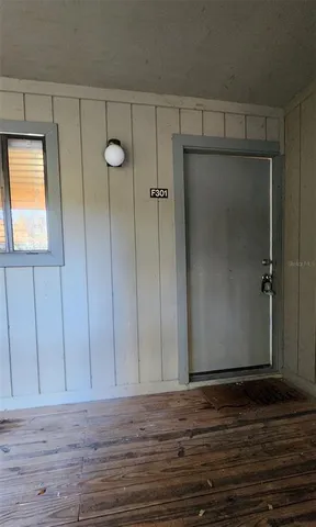 a view of room with wooden floor