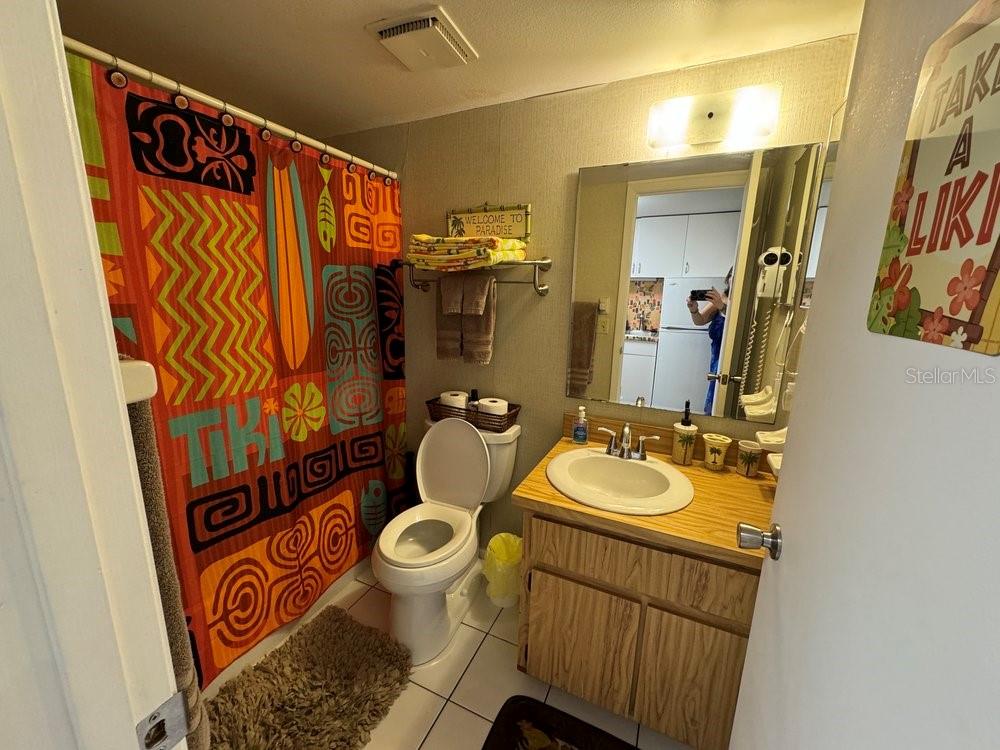 1865 Mazo Manor Road, Unit J2 Lutz, FL 33558 - Photo 12 of 12 a bathroom with a sink mirror vanity and toilet
