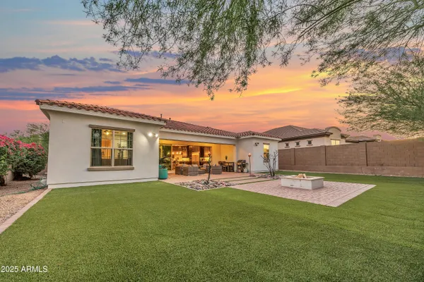 a view of a house with a yard porch and sitting area