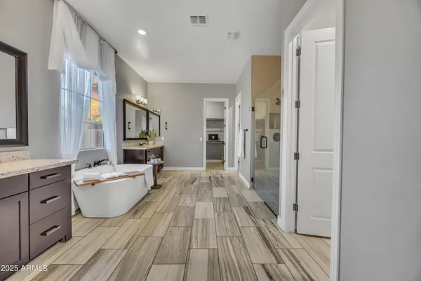 a large space with a large window and wooden floor