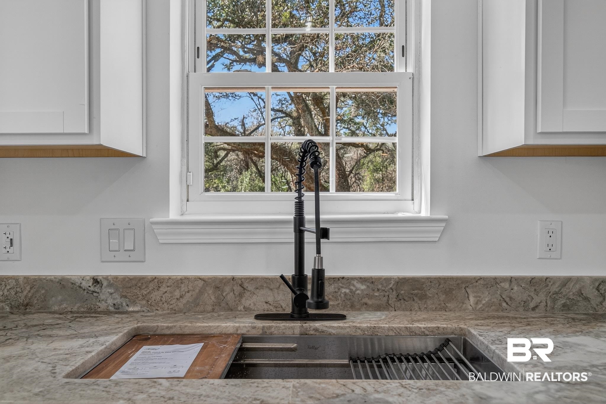 10650 Old Pascagoula Road Theodore, AL 36582 - Photo 26 of 77 Kitchen view of white cabinetry and light stone counters