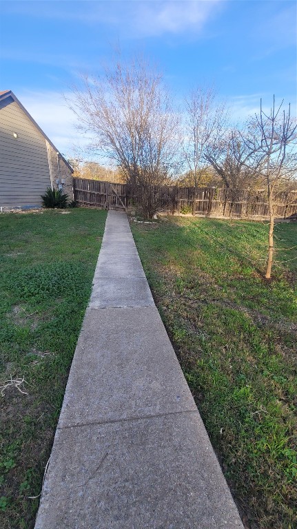 12410 Twin Creek Road Manchaca, TX 78652 - Photo 19 of 32 a view of a backyard with green space