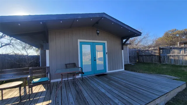 a large white kitchen with a large window