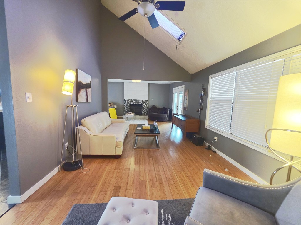 12410 Twin Creek Road Manchaca, TX 78652 - Photo 6 of 32 a living room with furniture and a wooden floor