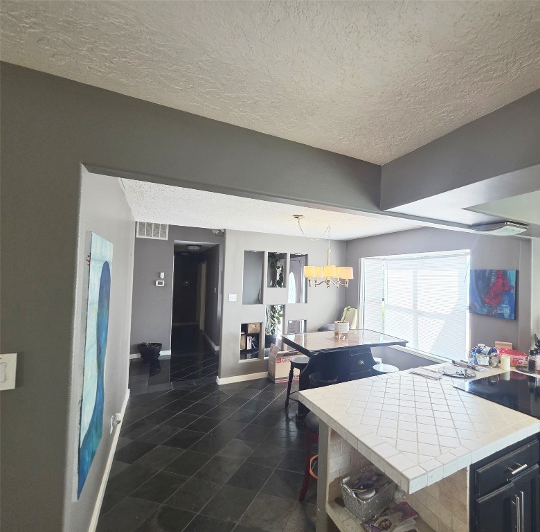 12410 Twin Creek Road Manchaca, TX 78652 - Photo 8 of 32 a living room with furniture a dining table and chairs