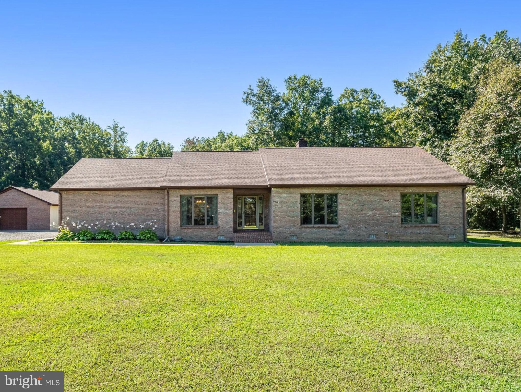 5119 Dickerson Road Partlow, VA 22534 - Photo 6 of 18 a front view of house with yard and trees in the background