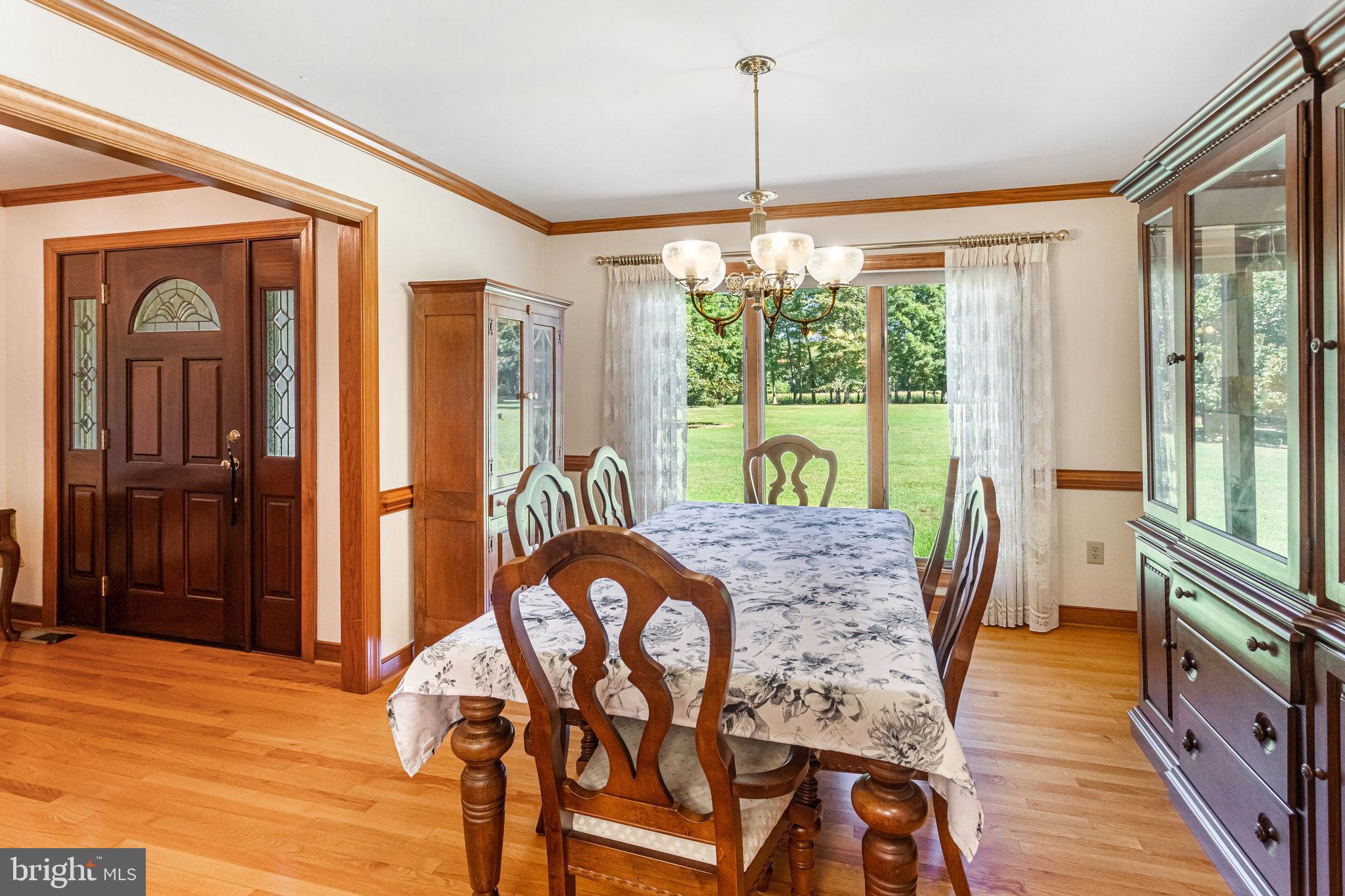 5119 Dickerson Road Partlow, VA 22534 - Photo 7 of 18 a view of a dining room with furniture window and wooden floor