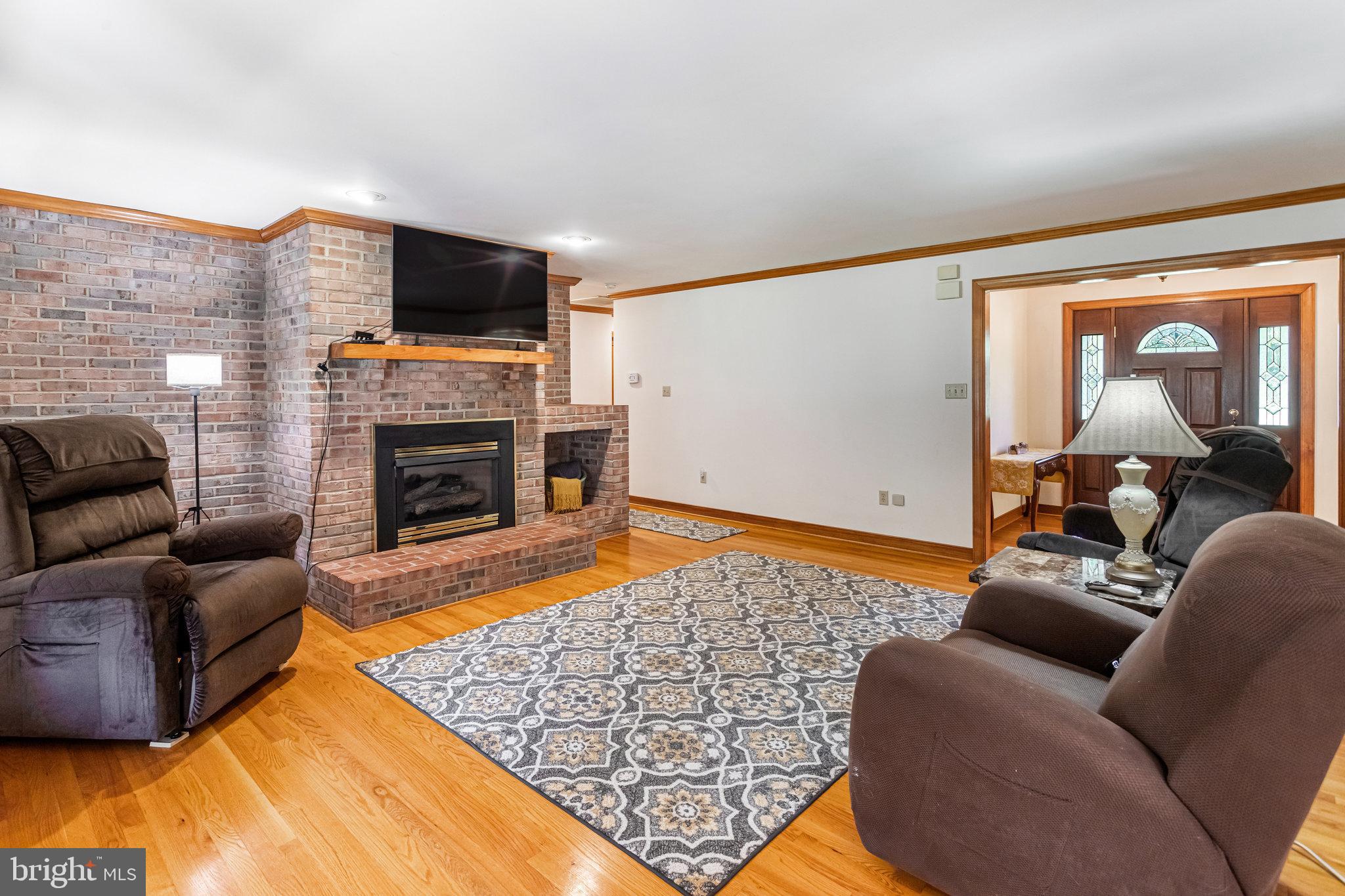 5119 Dickerson Road Partlow, VA 22534 - Photo 9 of 18 a living room with furniture and a flat screen tv
