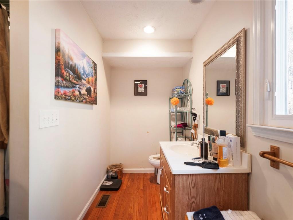 7389 Williams Road Flowery Branch, GA 30542 - Photo 14 of 49 a room with a workspace