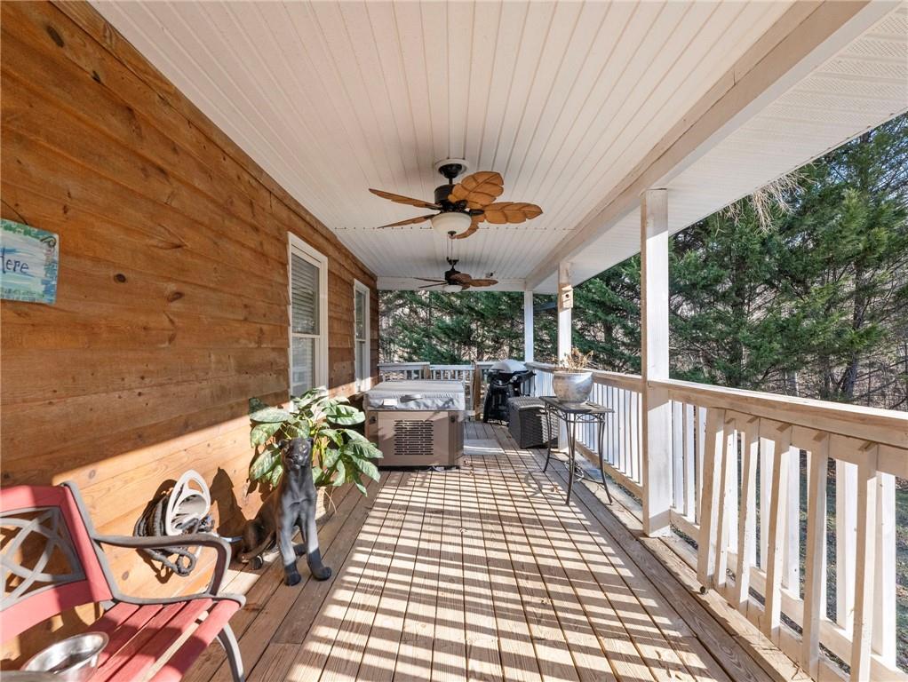 7389 Williams Road Flowery Branch, GA 30542 - Photo 42 of 49 a view of a patio with a table and chairs