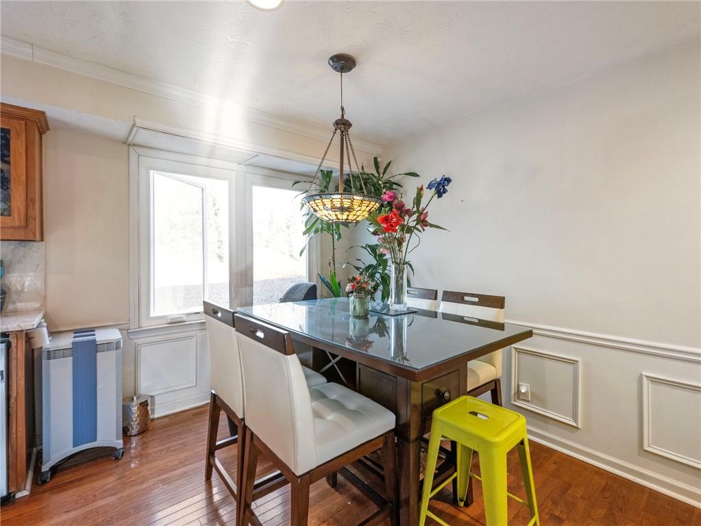 7389 Williams Road Flowery Branch, GA 30542 - Photo 5 of 49 a dining room with furniture and window