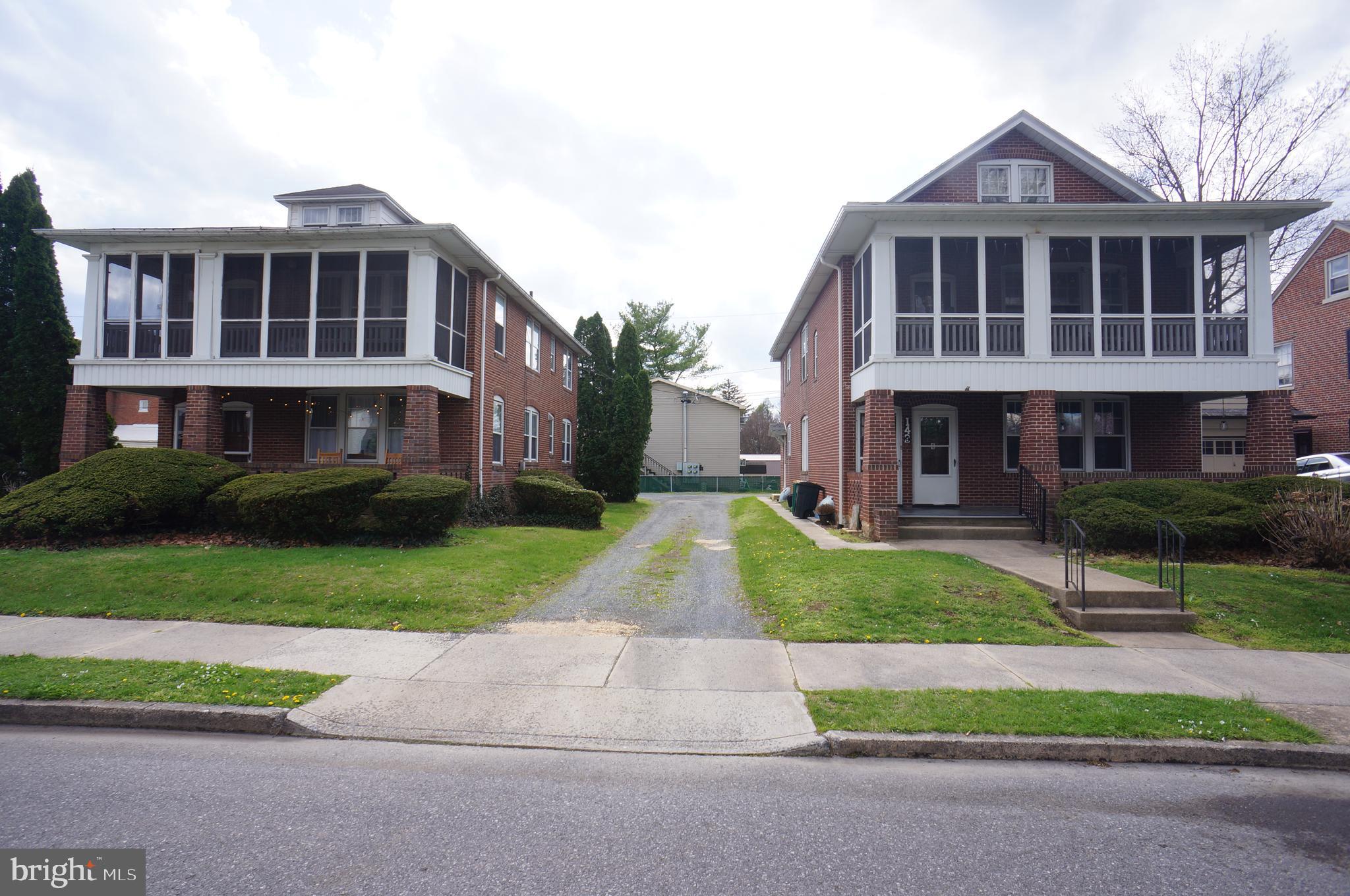 a view of house with yard and street view