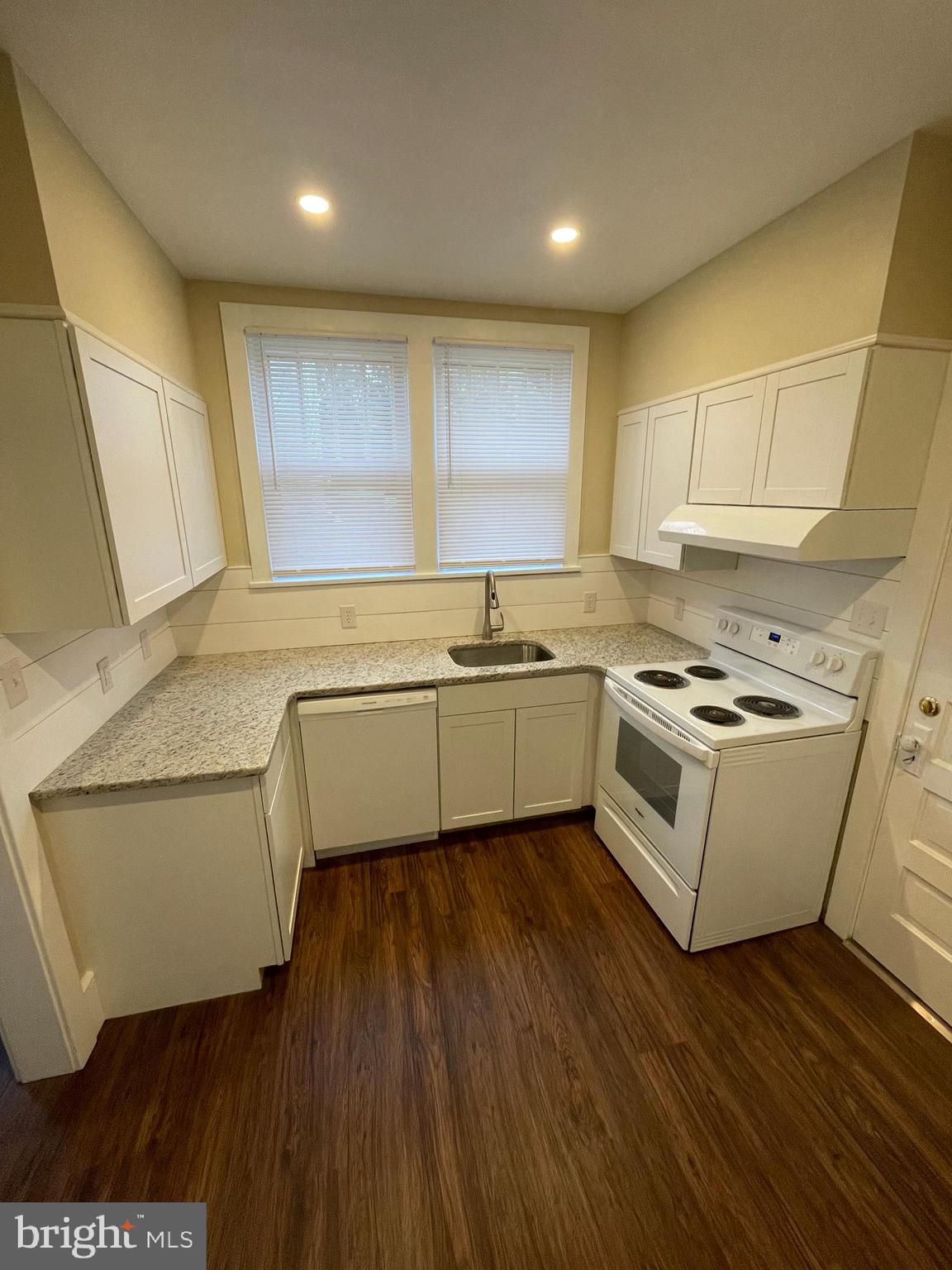 142 Riddle Road Chambersburg, PA 17201 - Photo 11 of 51 a kitchen with a sink a stove cabinets and wooden floor
