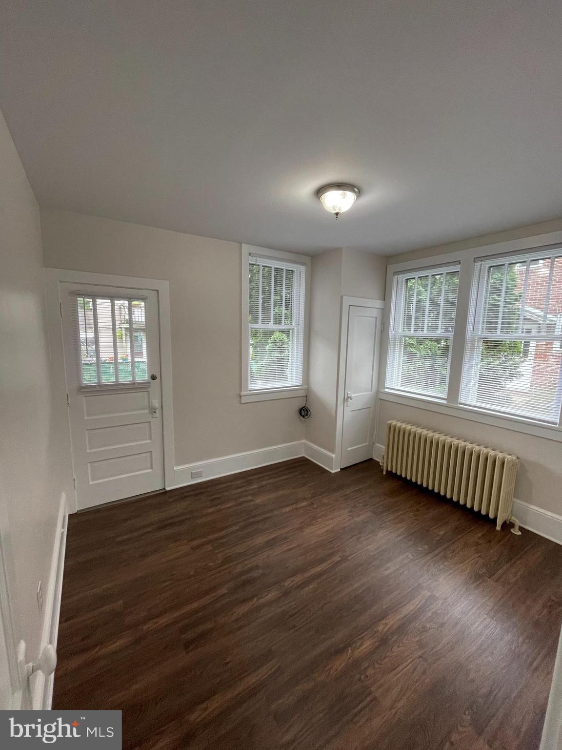 142 Riddle Road Chambersburg, PA 17201 - Photo 14 of 51 a view of an empty room with wooden floor and a window